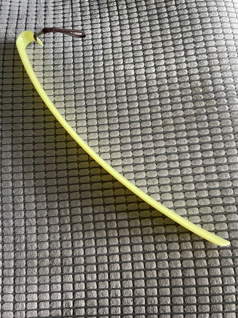 extra-long, yellow plastic long handled shoe horn