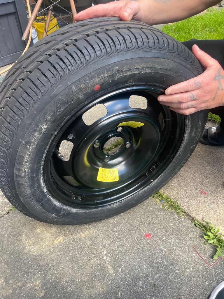 Brand new car tyre and wheel