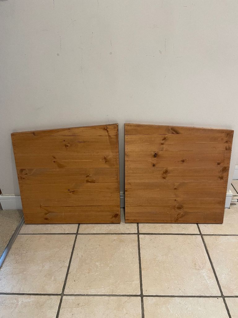 A pair of wooden side panels for a hutch for a rabbit or guinea pig