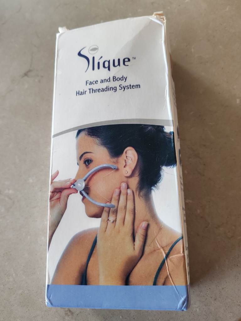 Slique facial hair threading system 