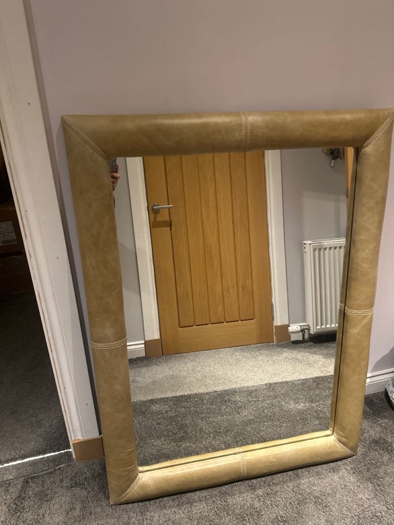 Leather mirror light brown. 