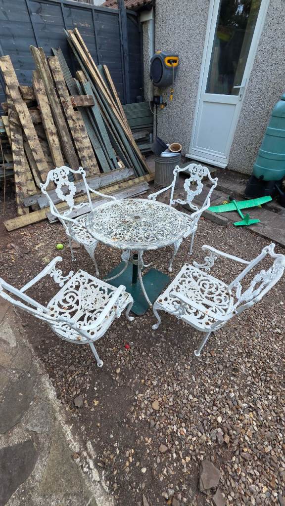  Cast Aluminium garden chairs and table 