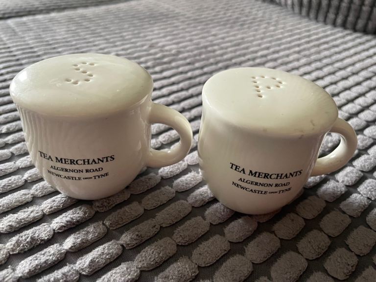 pair of Ringtons white ceramic teacup-shaped salt and pepper shakers