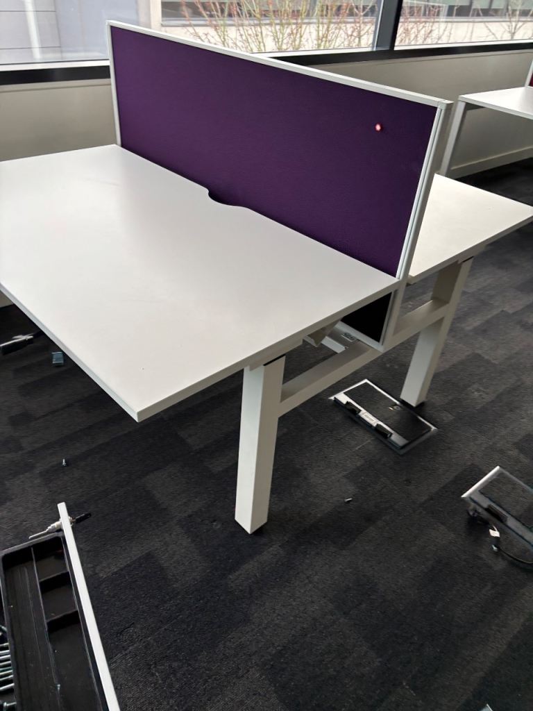 Pod of 2 height adjustable desks with partition