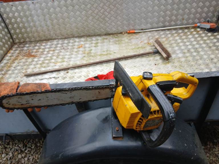 Three petrol chainsaws