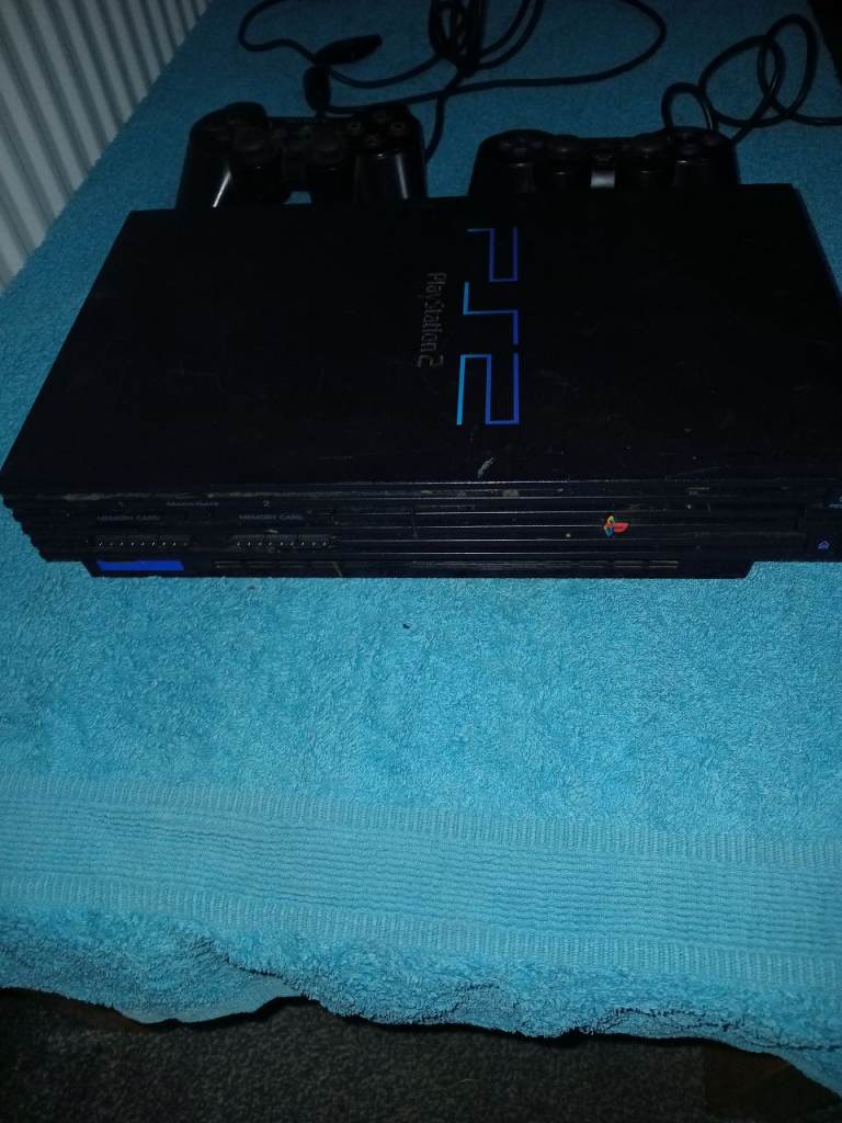 Playstation 2 console with 2 games