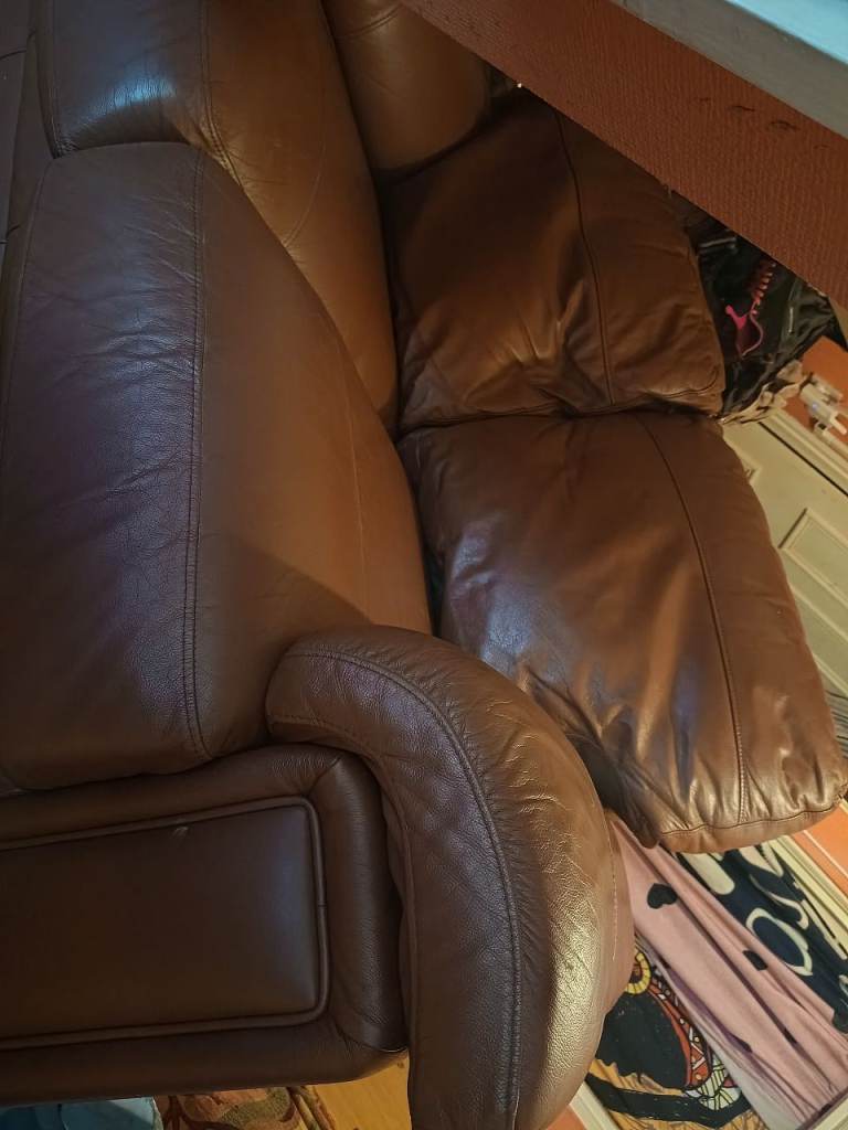 Small two seater brown leather sofa 