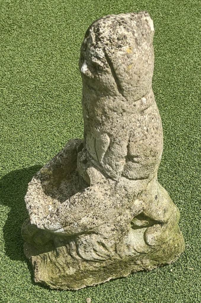Beautifully weathered vintage reconstituted stone garden gnome pushing wheelbarrow