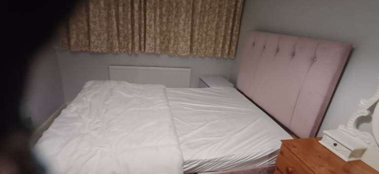Room in private house with shared facilities for single occupancy.