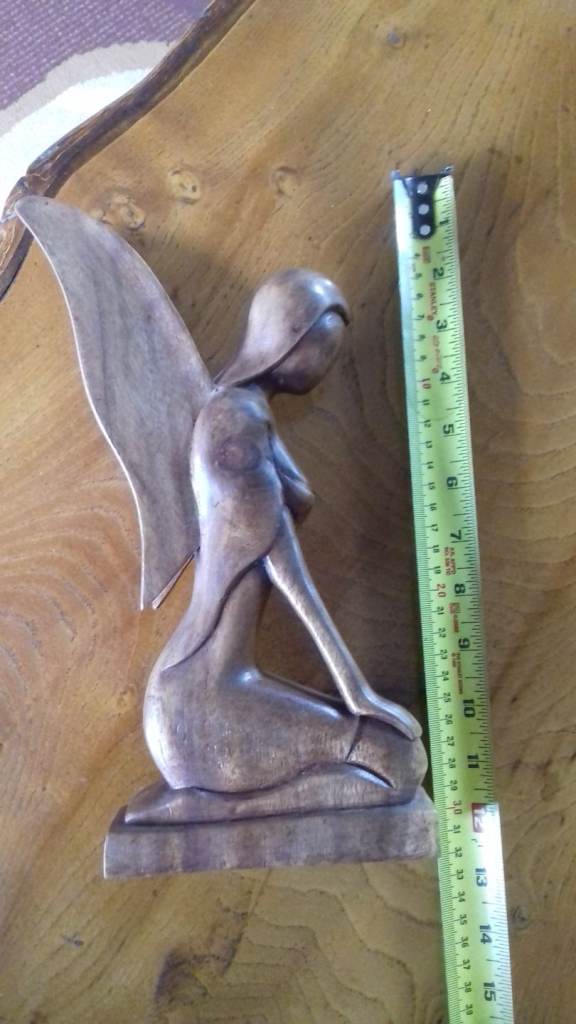 Wooden Seated angel and singing monk