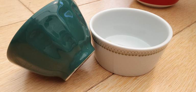 Selection of colourful cups, plates and bowls