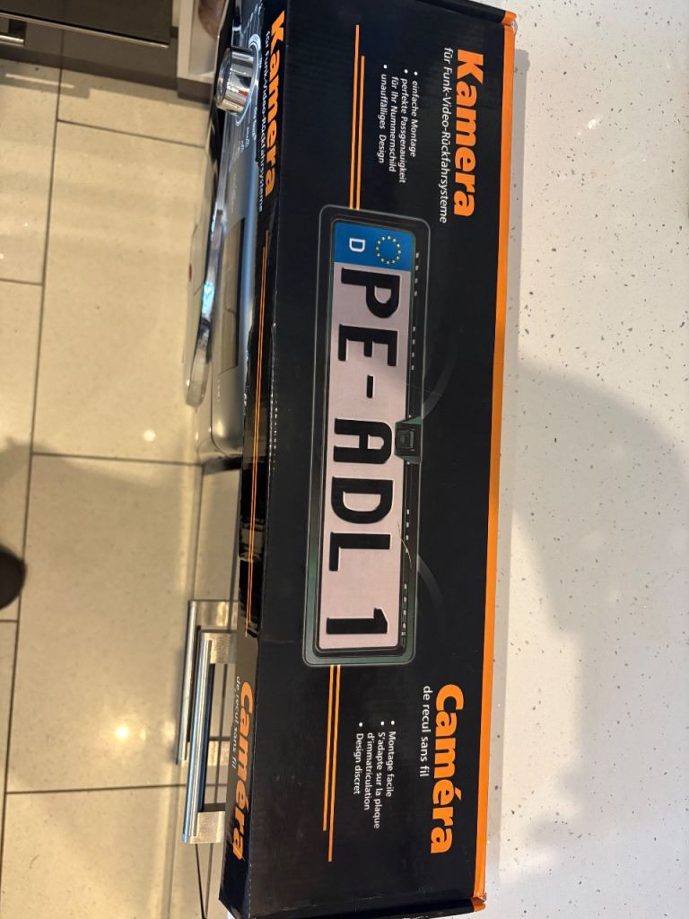 Reverse camara and number plate holder 