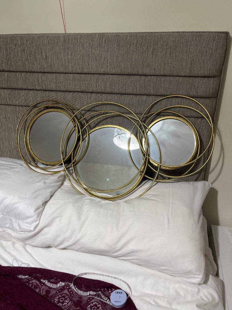 Ornate, modern Brass coloured metal mirror 