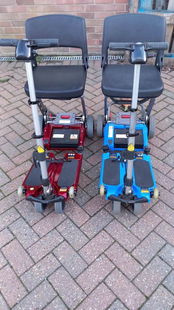 Pair of folding luggie mobility scooters