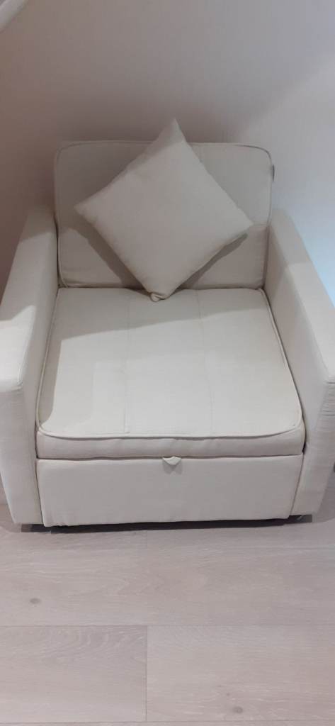 Cream single sofa bed. As new. Pillow & cushion.