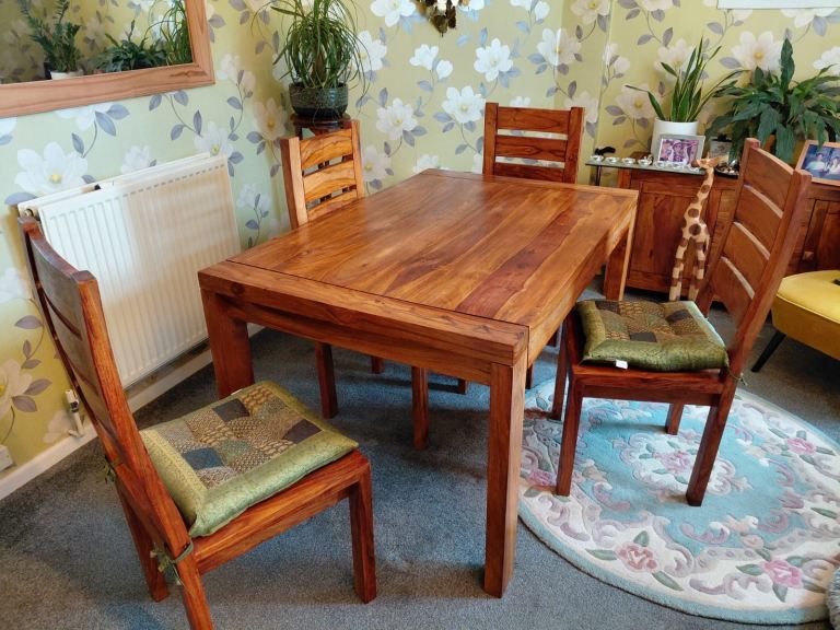 Solid Sheesham wood table and four chairs with cushions 