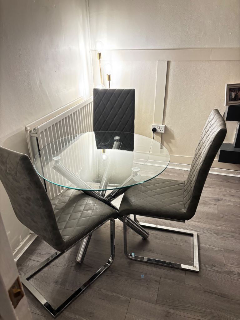 Round glass dining table and 3 chairs 