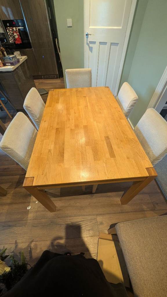 Solid oak dining table and 5 cream velvet covered chairs 