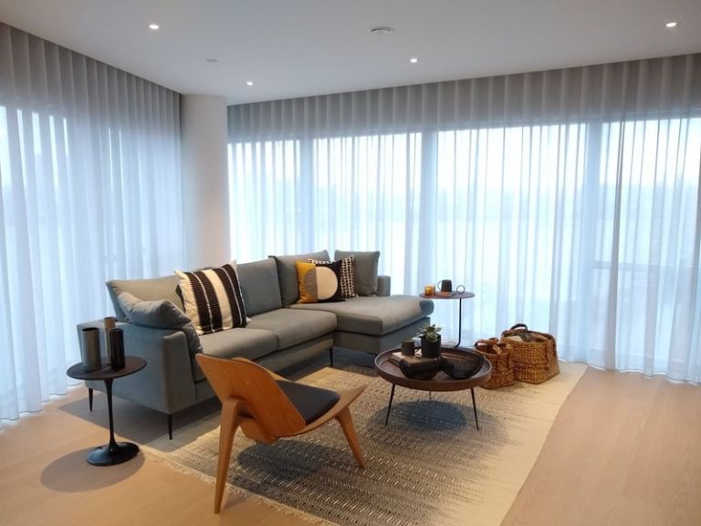 Curtain fitter. Curtain tracks installation for bay windows