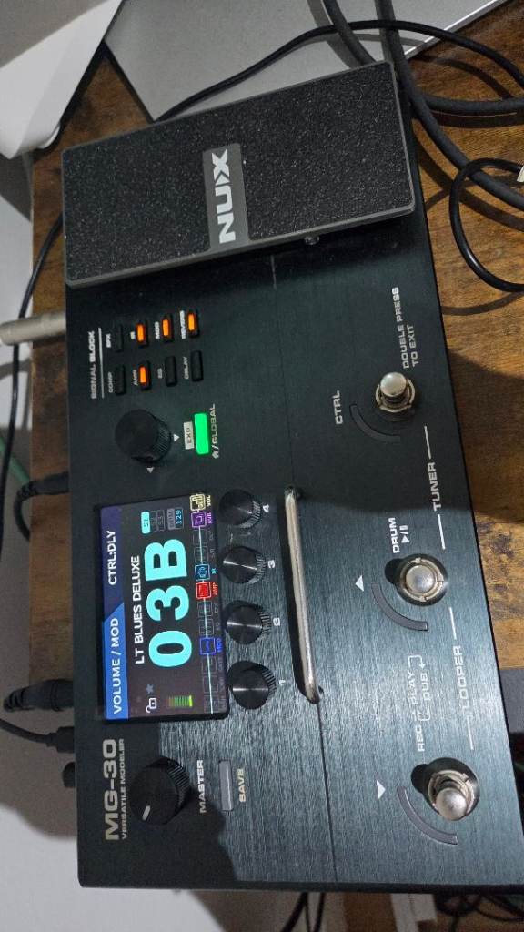 NUX MG-30 multi-effects guitar processor with matching footswitch.