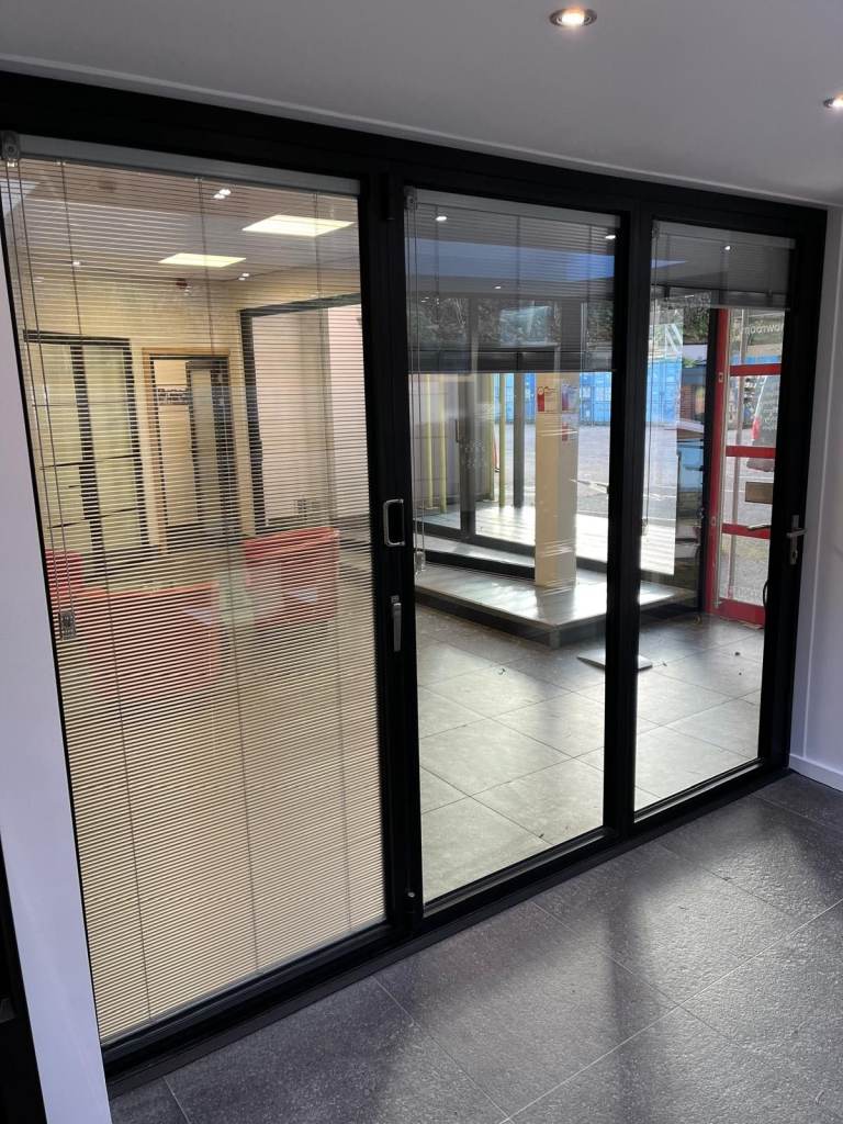 Aluminium Bi-Folding Doors with Integrated Blinds