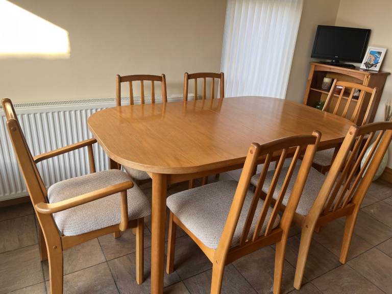 Extending teak dining table and 6 chairs