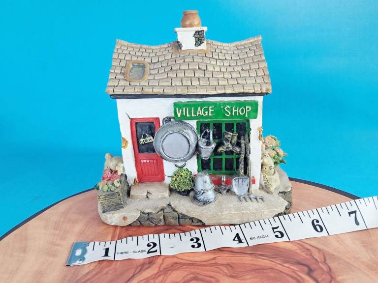 This is a Vintage Tell Tale Village Shop collectible. ( heavy).