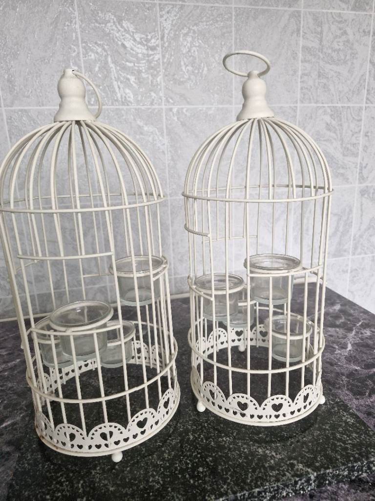 Two bird cages  tea light holders