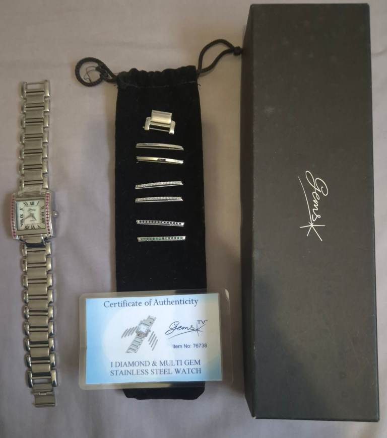 Gems 1 diamond and multi gem stainless steel wrist watch with c.o.a 