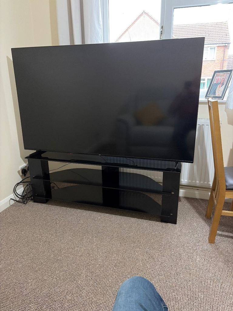 Large Black Flat Screen TV with Glass Stand