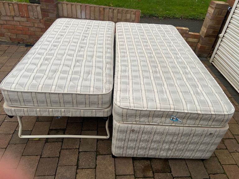 Myer’s single divan bed with pull out bed and mattresses 