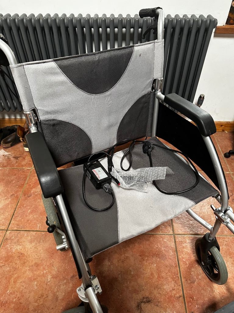 Power assisted folding wheelchair  