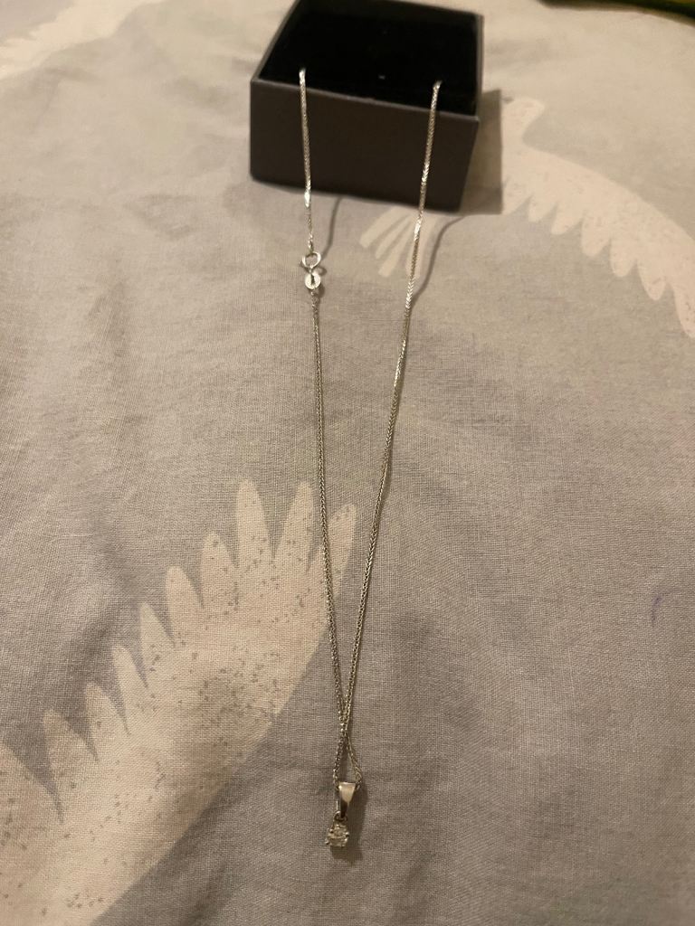 18 carat diamond 20 point pendant on chain.