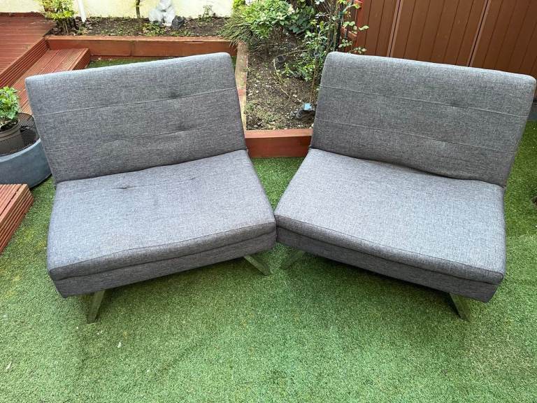 Three click-clack folding soft chairs that can be arranged into a sofa-bed.  