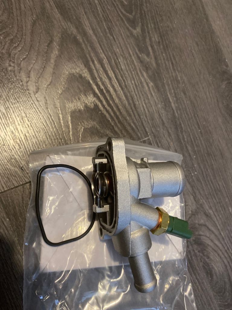 Fiat punto thermostat and housing. New with box.
