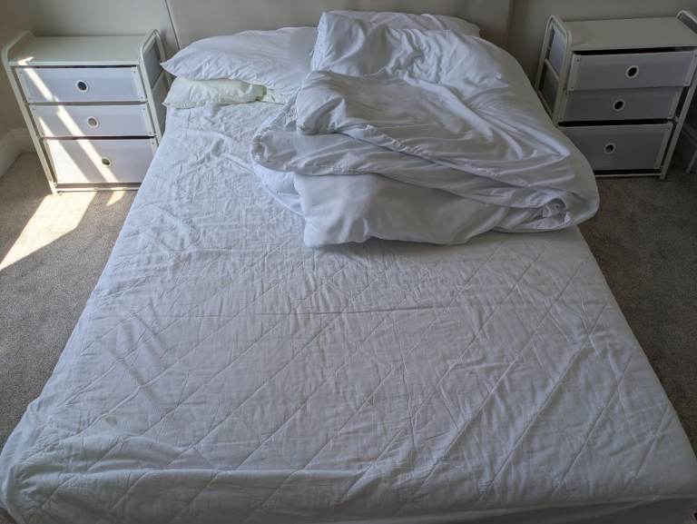 Double IKEA mattress and modern bedframe