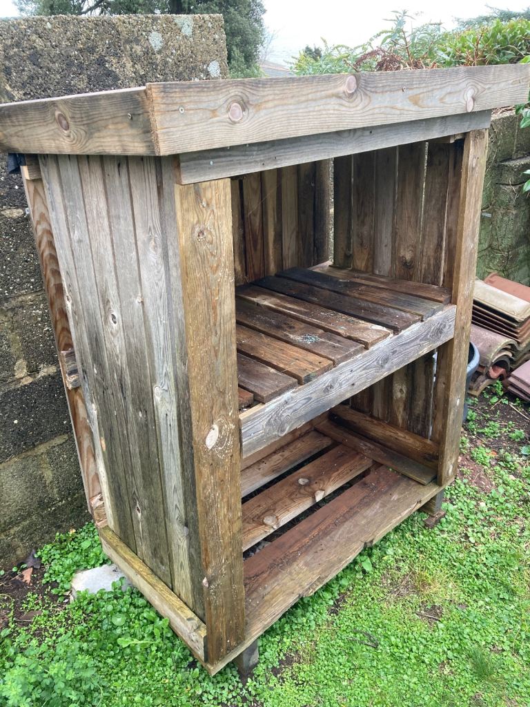 Small recycled Pallet log store 