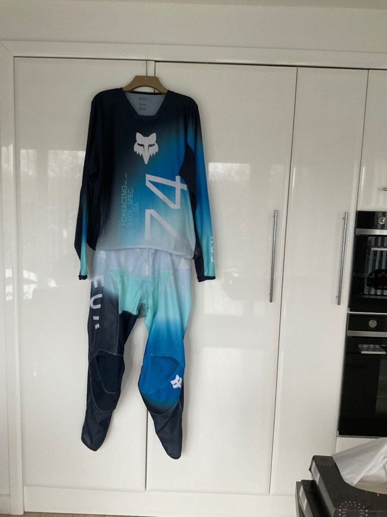 Motorcross top and pants, boots and goggles