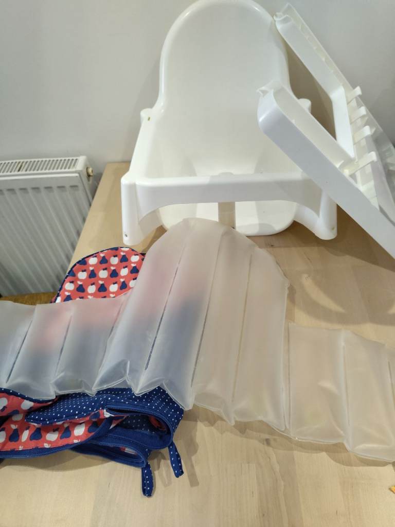 IKEA high chair with tray and inflatable insert and 2 cloth covers 