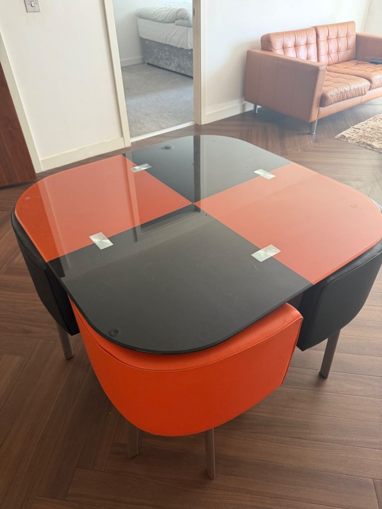 Modern Glass Dining Table with 4 Chairs – Black and Orange