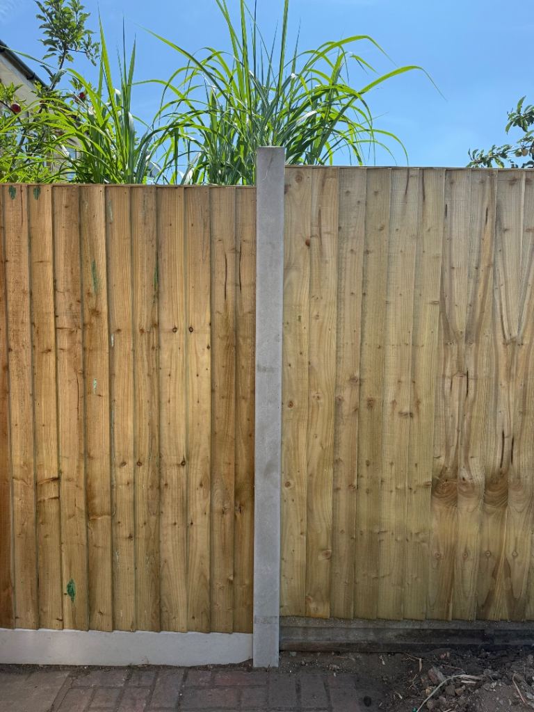 Two 9ft concrete fence posts (picture is as installed) and four bags of postcrete