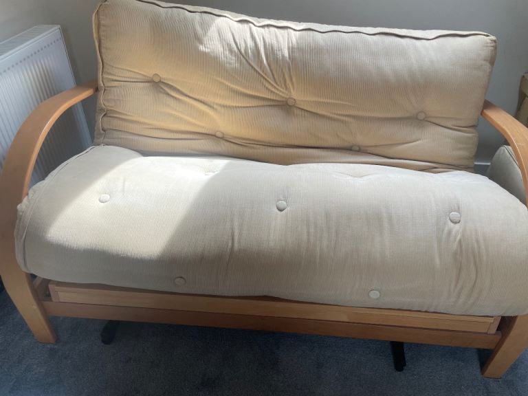 Cream and wood sofa bed