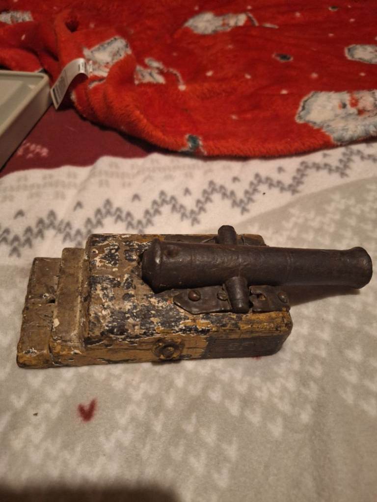 Antique canon on wooded base