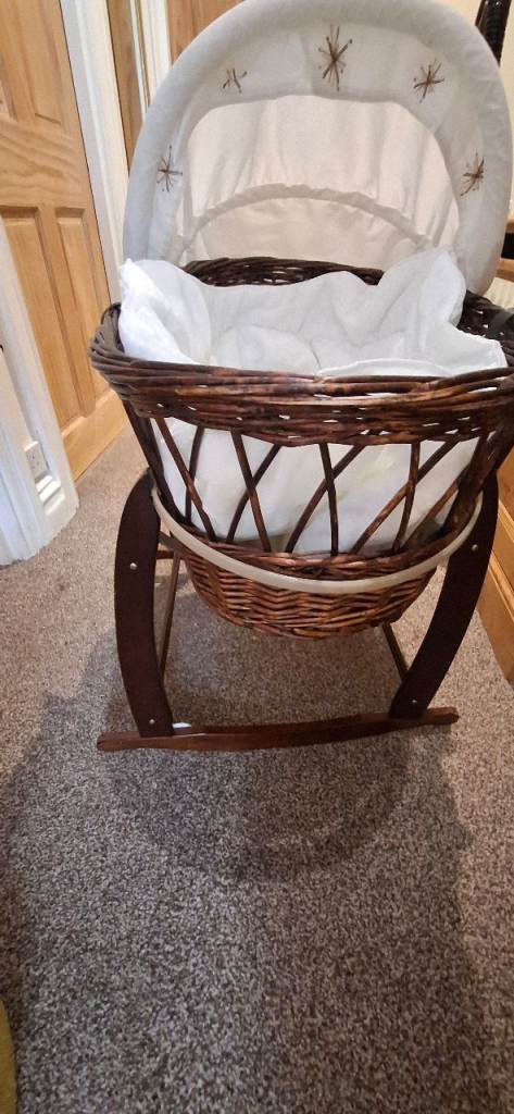Moses basket with bedding and stand £20