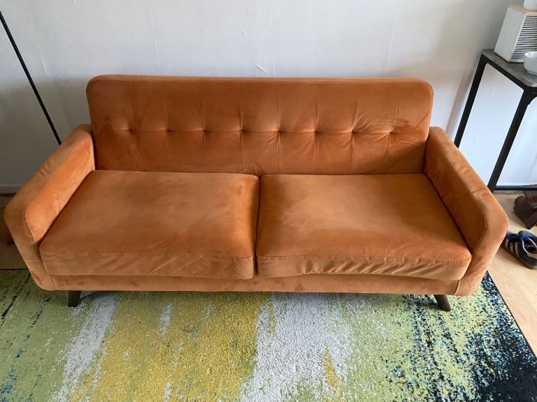 Two velvet orange sofas 