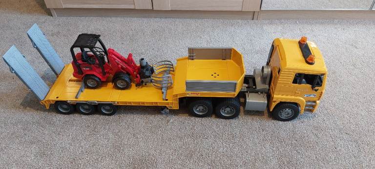 Bruder vehicle transporter and Schaffet bale carrier