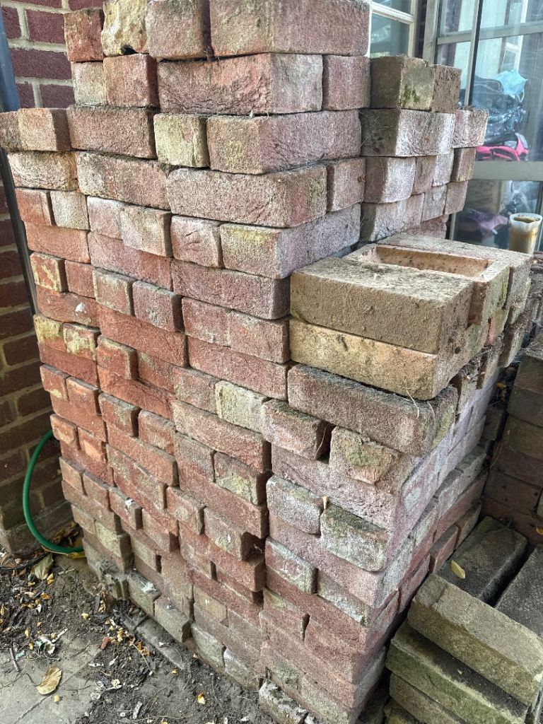 Stack of Used Red Bricks for Garden or Building Project