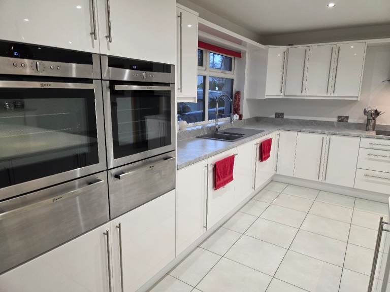 White gloss kitchen and appliances.  Immaculate