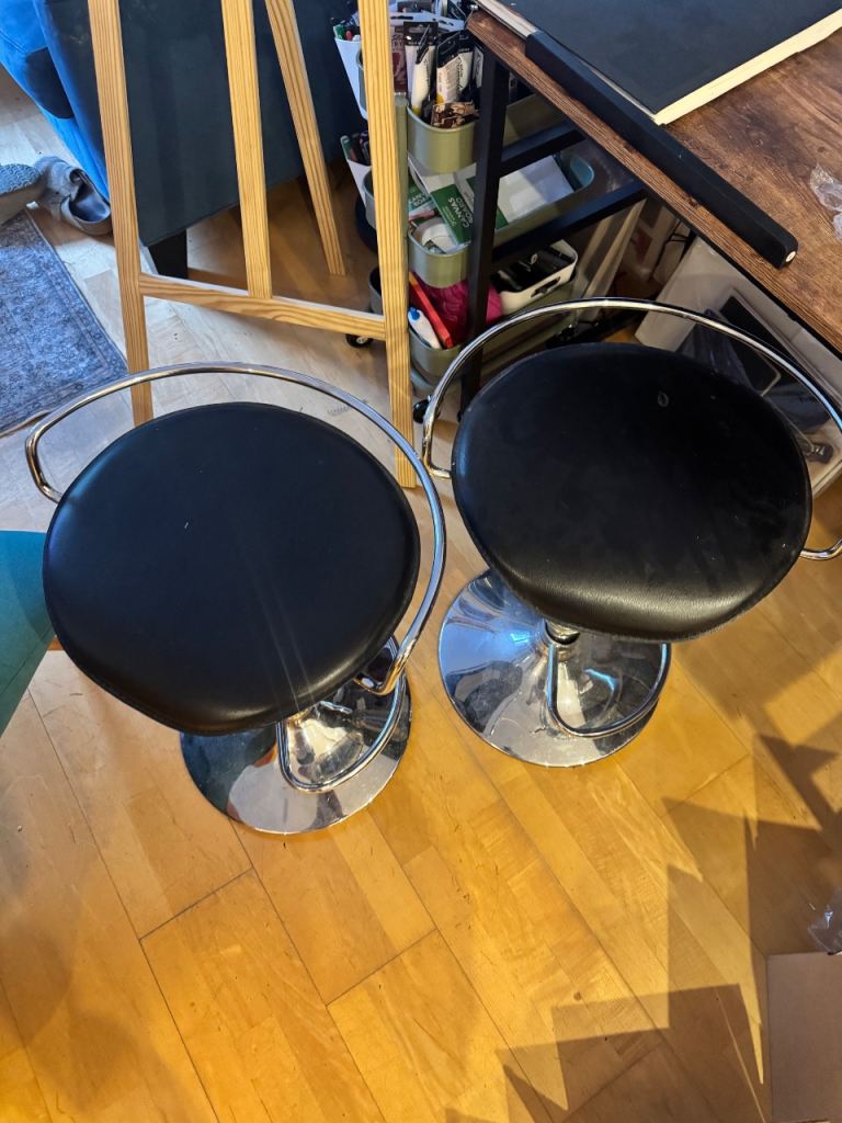 Black adjustable bar stools 