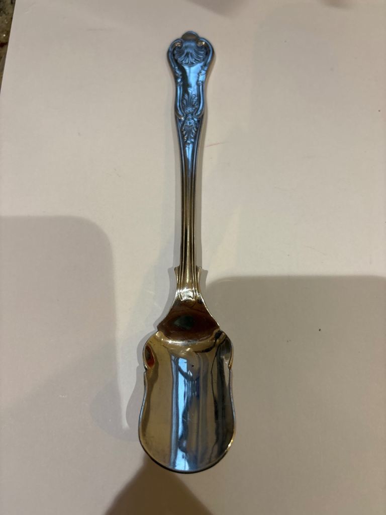 £5 Silver plate long spoon.